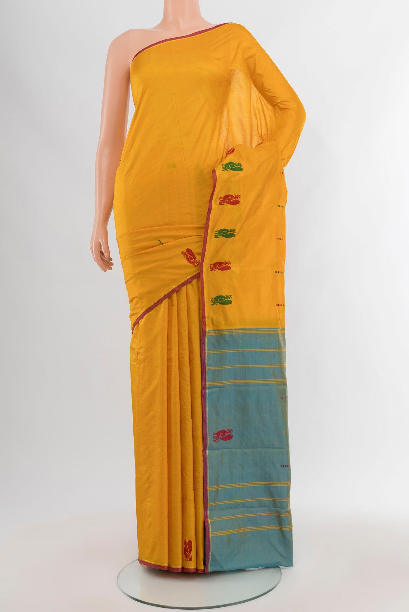Yellow Kanchipuram Silk Saree with Thread Butta on the body and Thread Border.  displayed on a mannequin