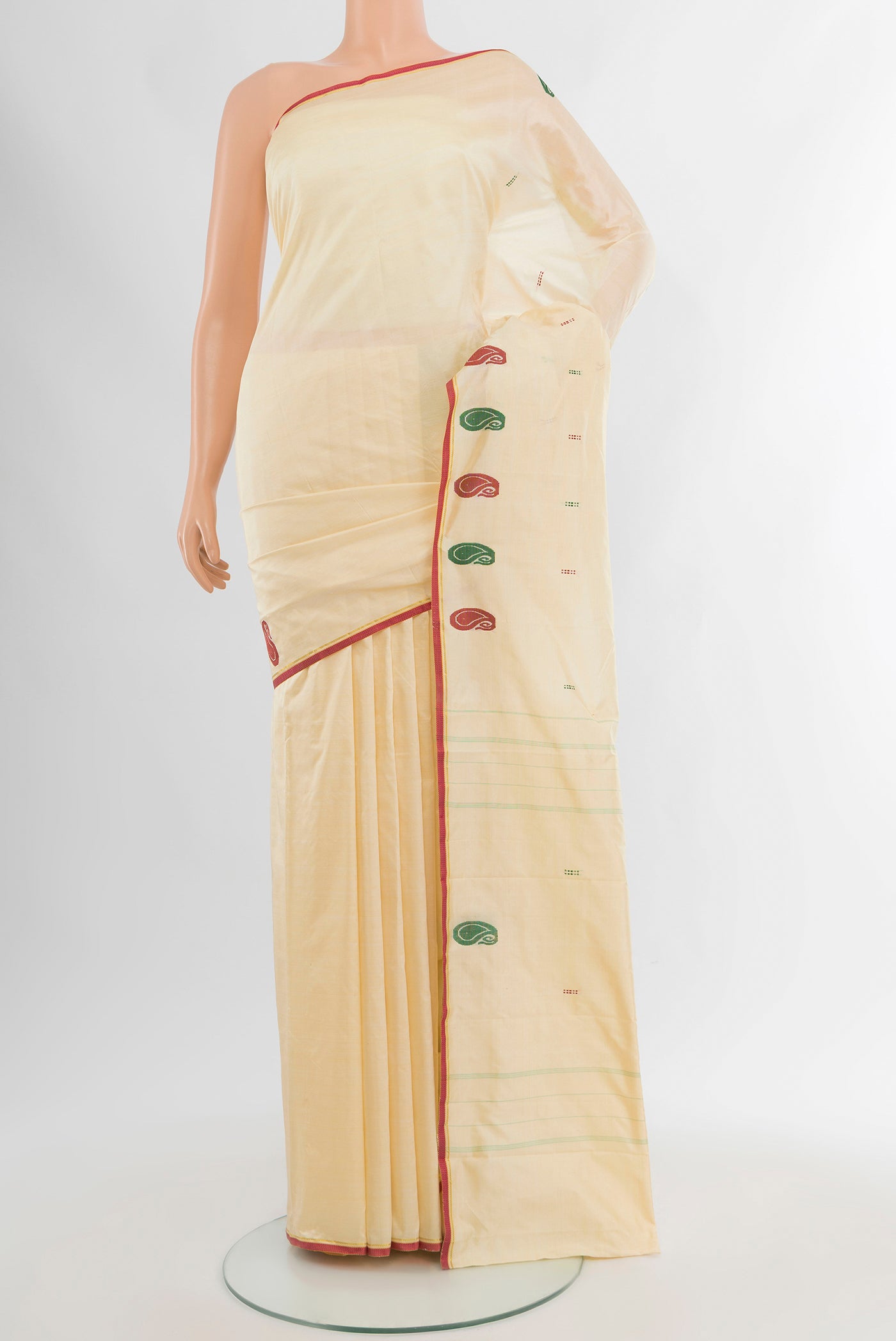 Cream Kanchipuram Silk Saree with Thread Butta on the body and Thread Border.  displayed on a mannequin