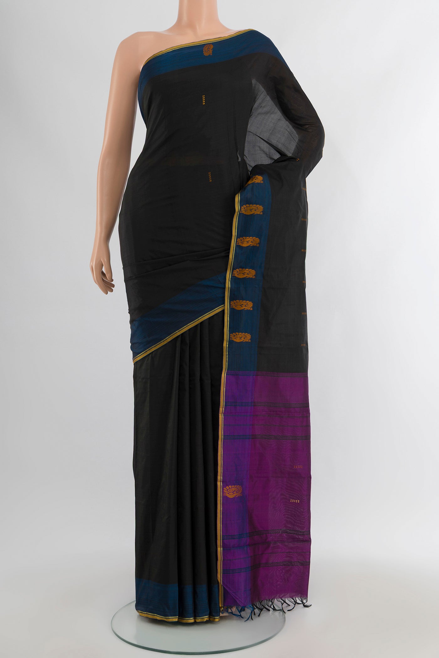 Black Kanchipuram Silk Saree with Thread Butta on the body and Thread Border.  displayed on a mannequin