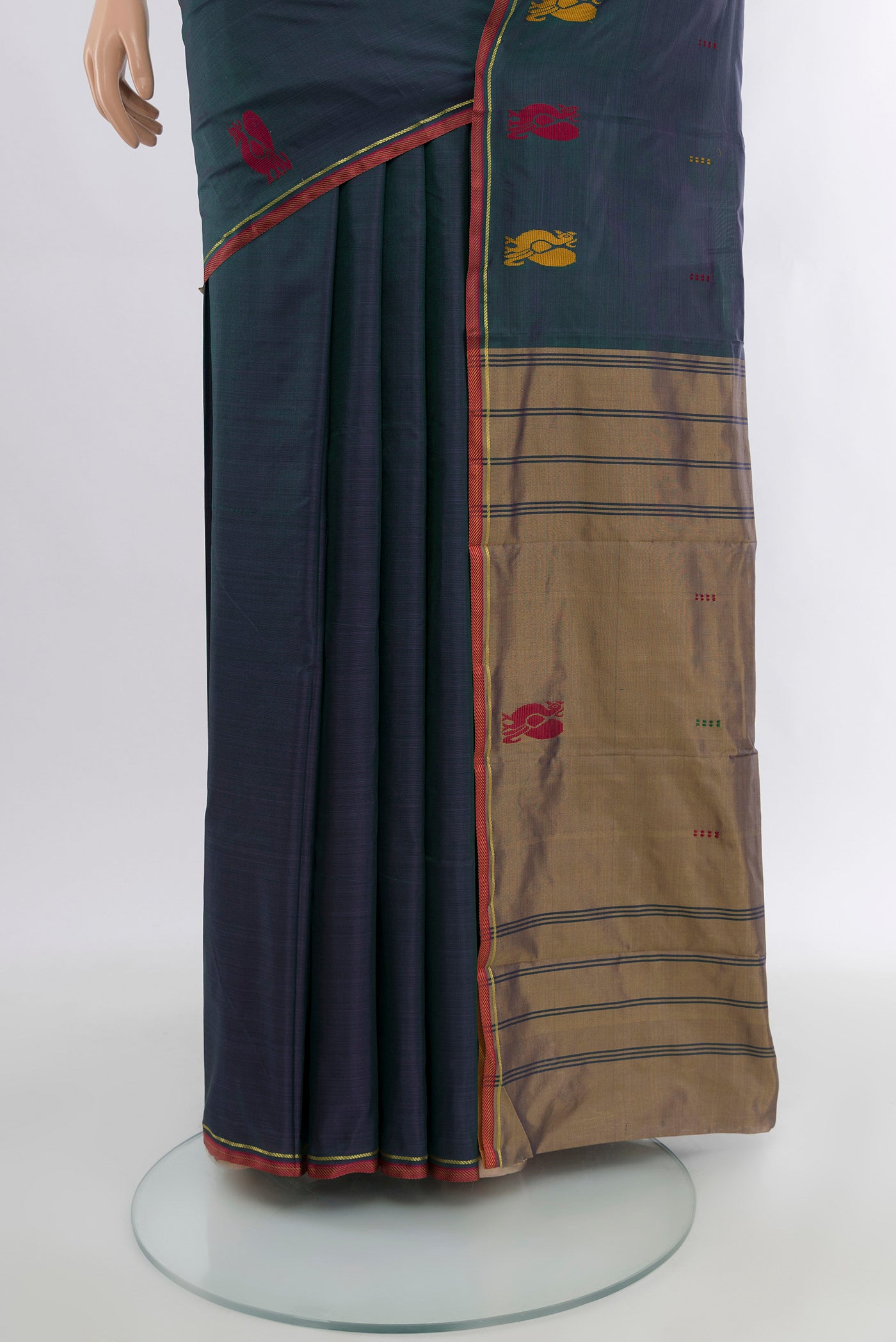 Pleats and pallu of Peacock Blue Kanchipuram Silk Saree with Plain Body and Thread Border. 