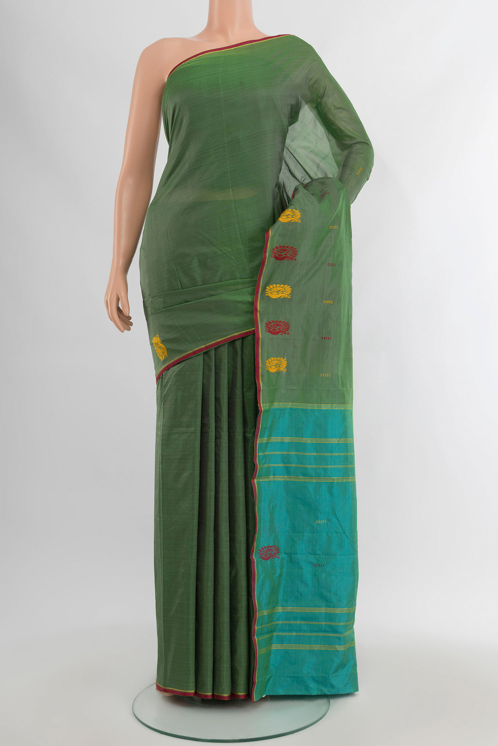 Green Kanchipuram Silk Saree with Plain Body and Thread Border.  displayed on a mannequin