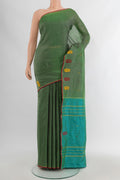 Green Kanchipuram Silk Saree with Plain Body and Thread Border.  displayed on a mannequin