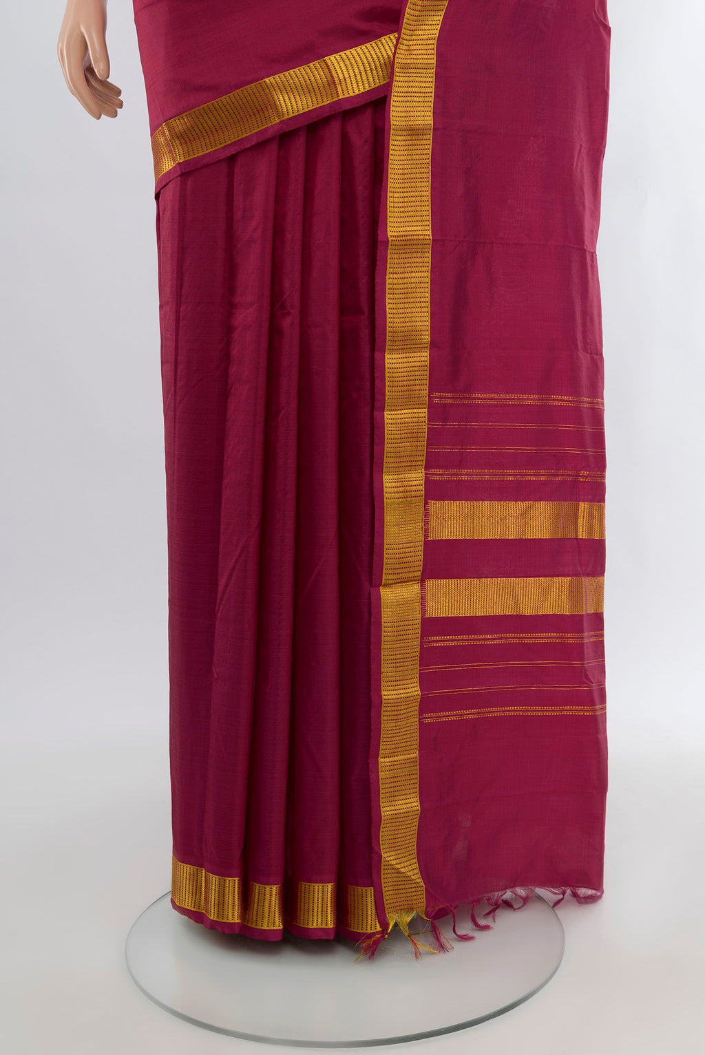 Pleats and pallu of Maroon Kanjivaram Silk Saree with Plain Body and Zari Border. 