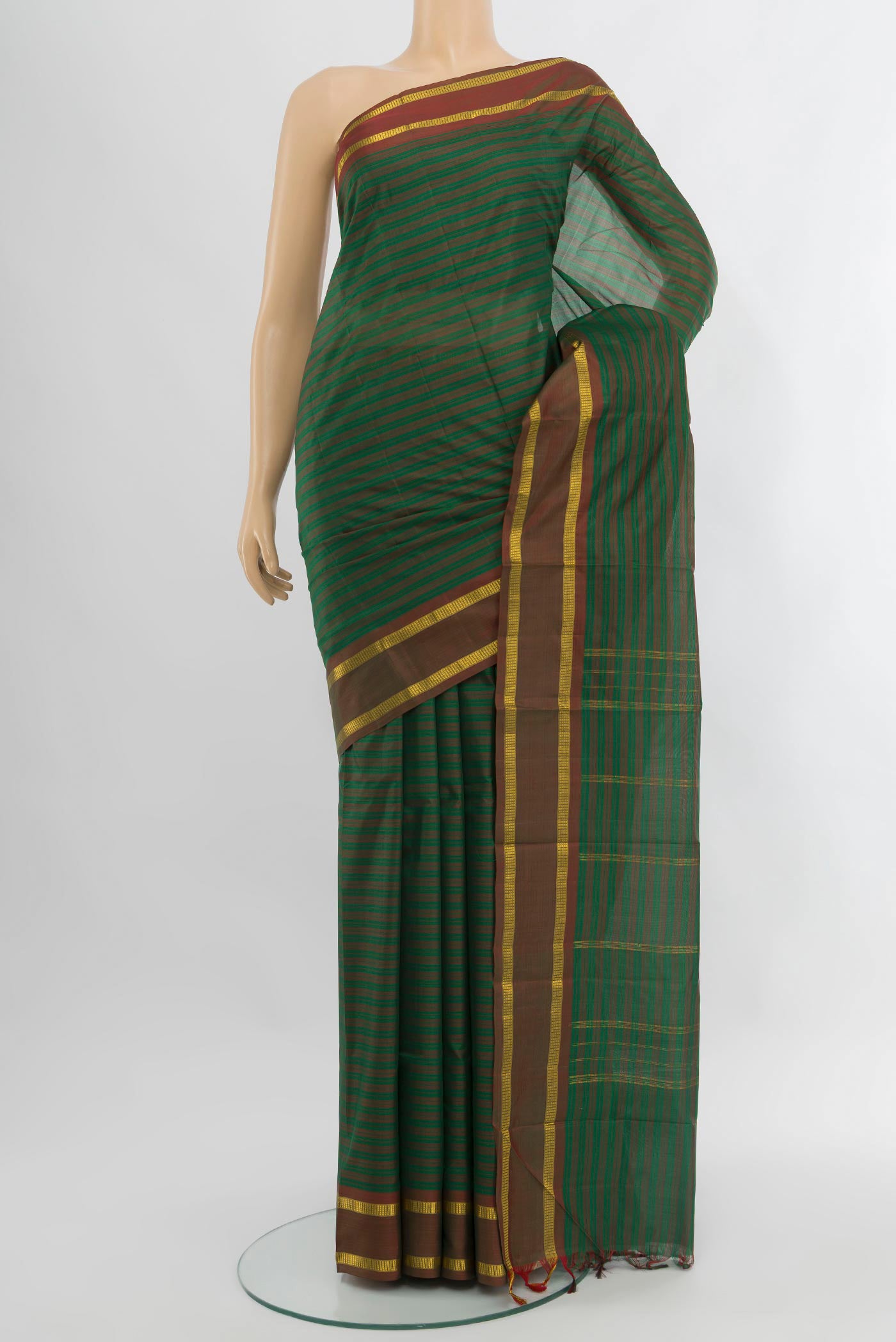 Green Kanjivaram Silk Saree with Stripes on the body and Zari Border.  displayed on a mannequin