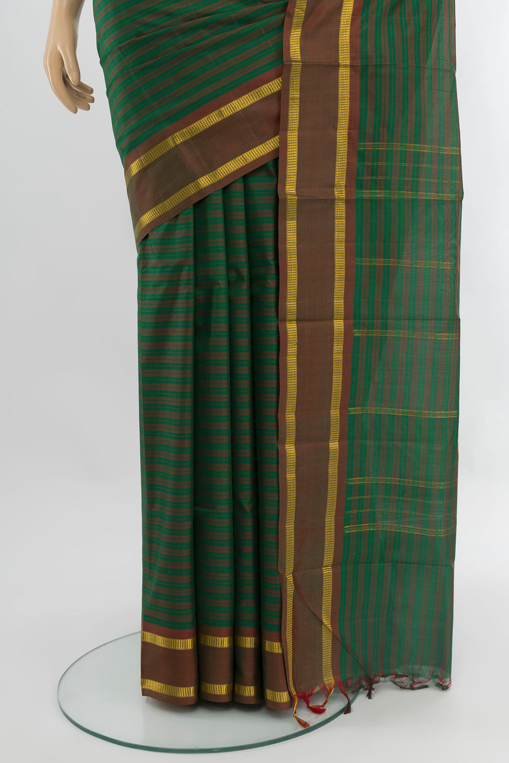 Pleats and pallu of Green Kanjivaram Silk Saree with Stripes on the body and Zari Border. 