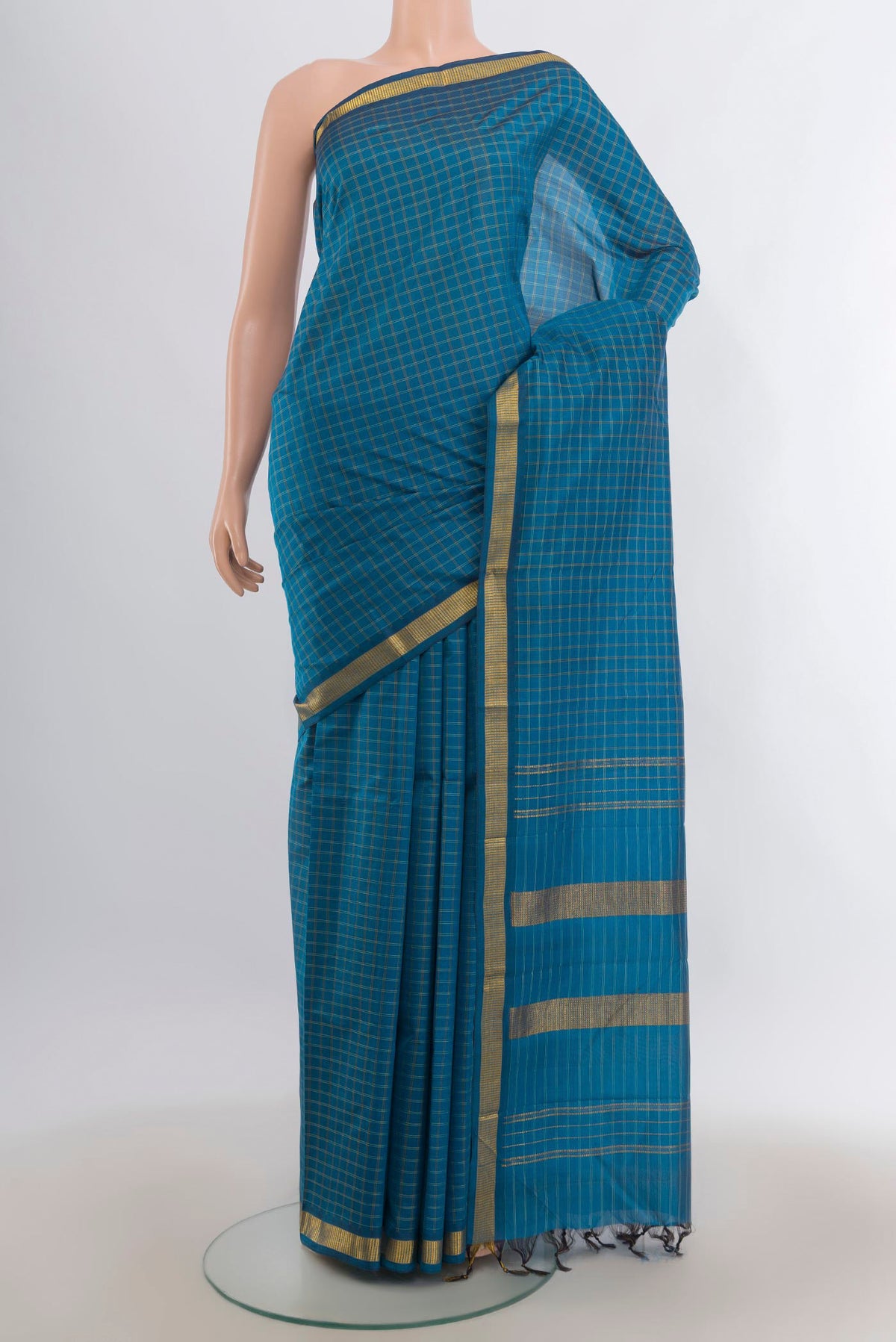 Pure Silk Blue Kanjivaram Saree with Checked design on the body and Zari Border.  displayed on a mannequin