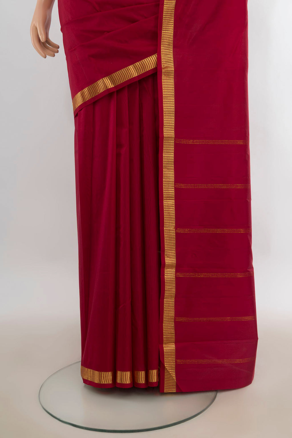 Pleats and pallu of Pure Silk Deep Red Kanjivaram Saree with Plain Body and Zari Border. 
