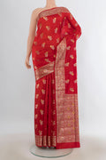 Pure Silk Red Banarasi Raw Saree with Zari Butta on the body and Zari Border.  displayed on a mannequin