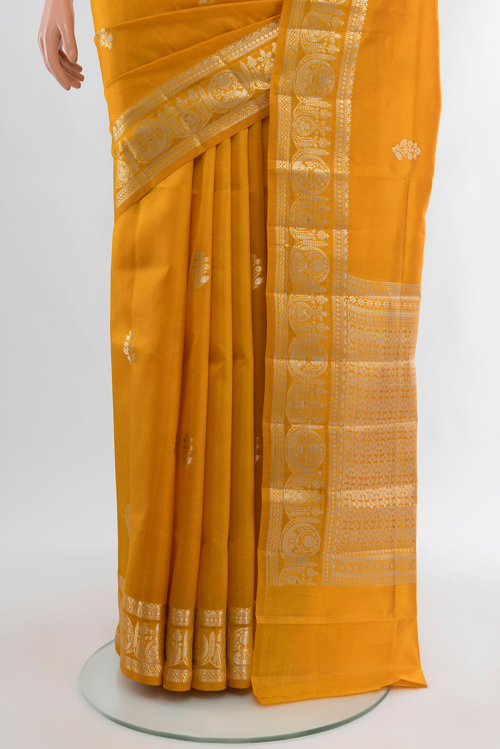 Pleats and pallu of Mustard Banarasi Raw Silk Saree with Zari Butta on the body and Zari Border. 