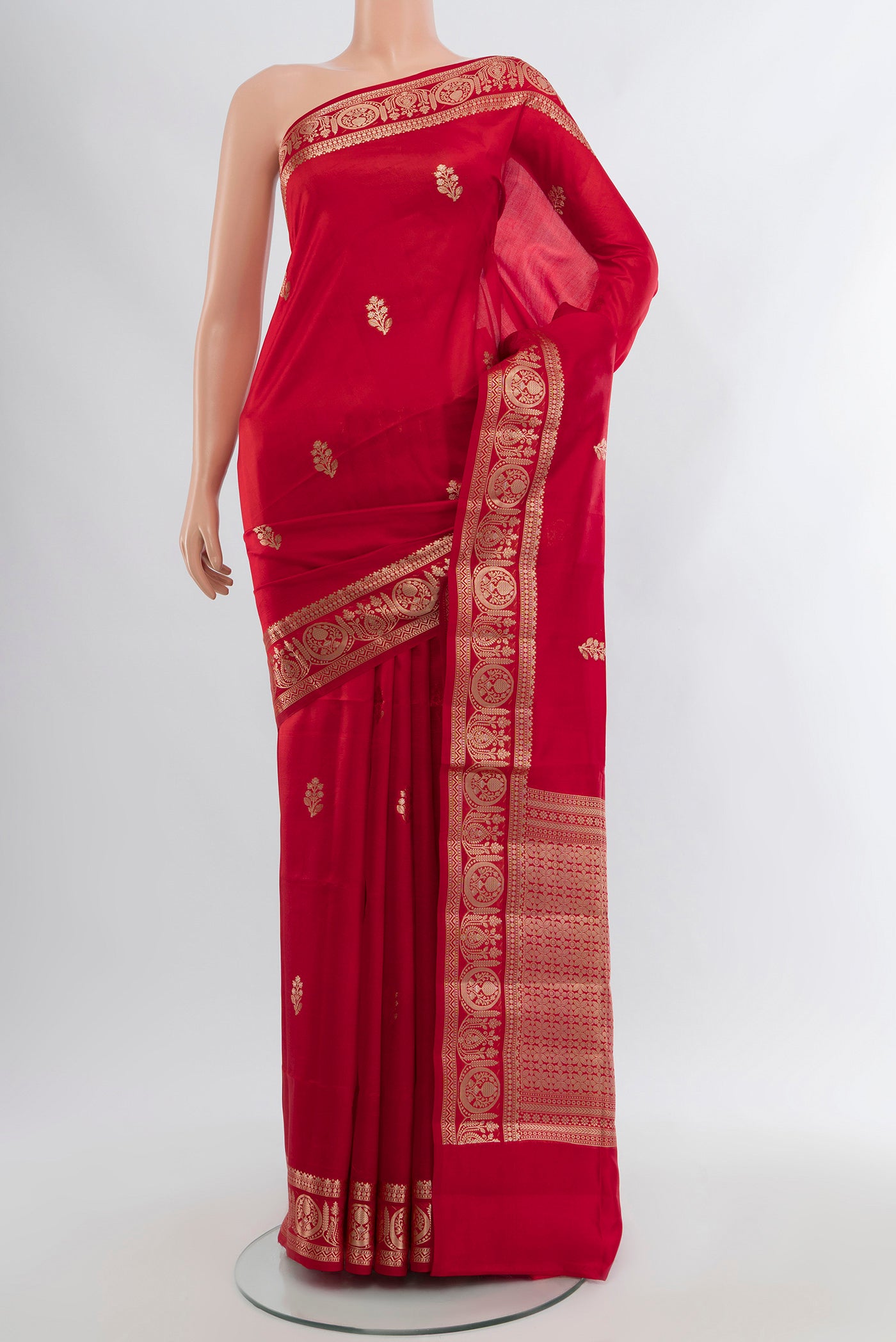 Red Banarasi Raw Silk Saree with Zari Butta on the body and Zari Border.  displayed on a mannequin