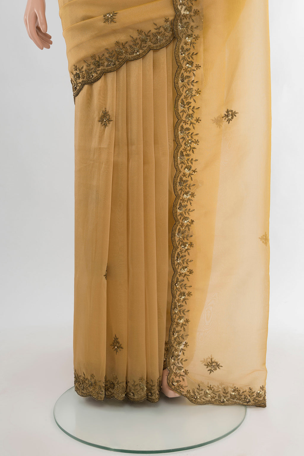 Pleats and pallu of Sandal Blended Embroidery Net Saree with Embroidery on the body and Embroidery Border. 