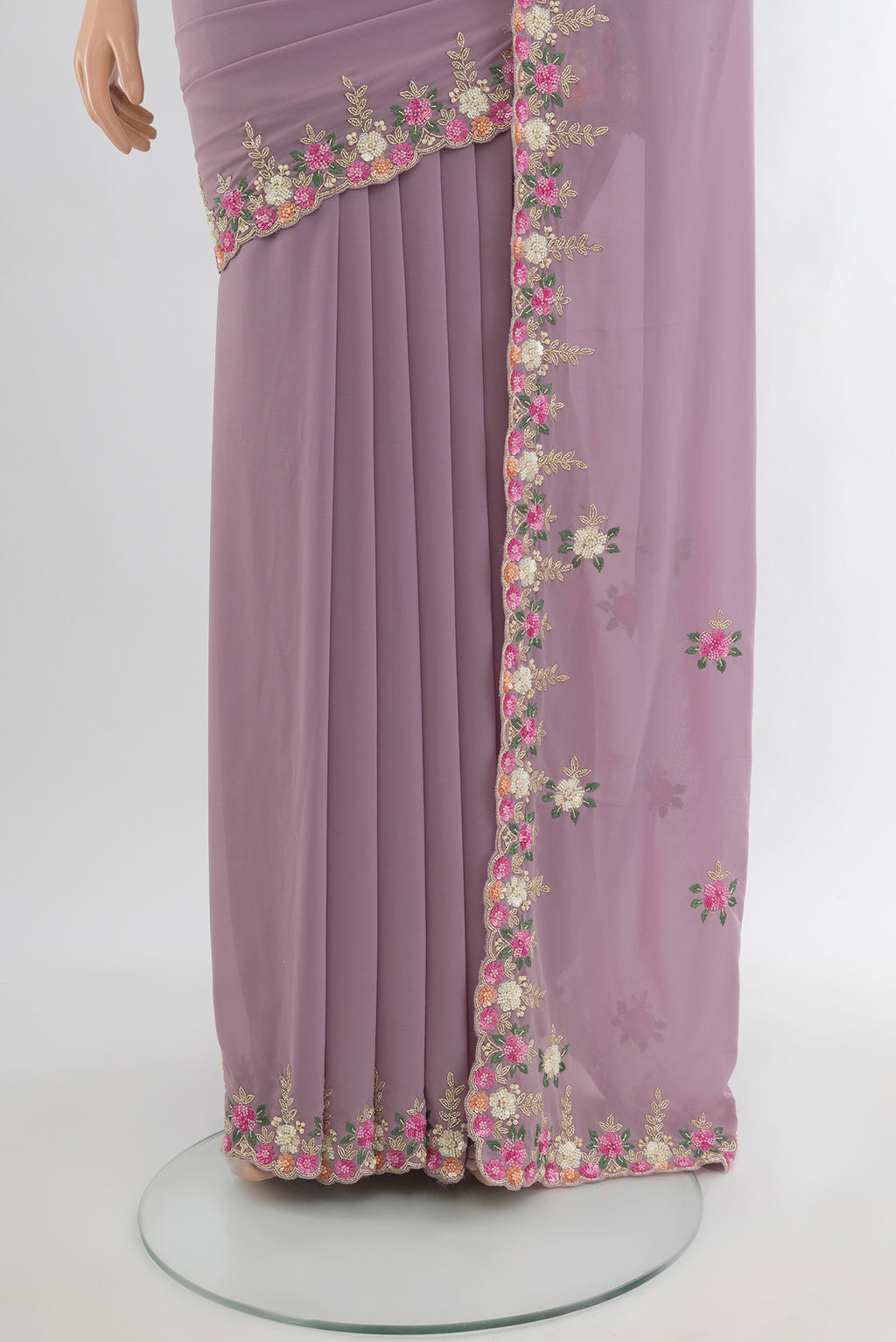 Pleats and pallu of Lavender Blended Georgette Saree with Embroidery on the body and Embroidery Border. 