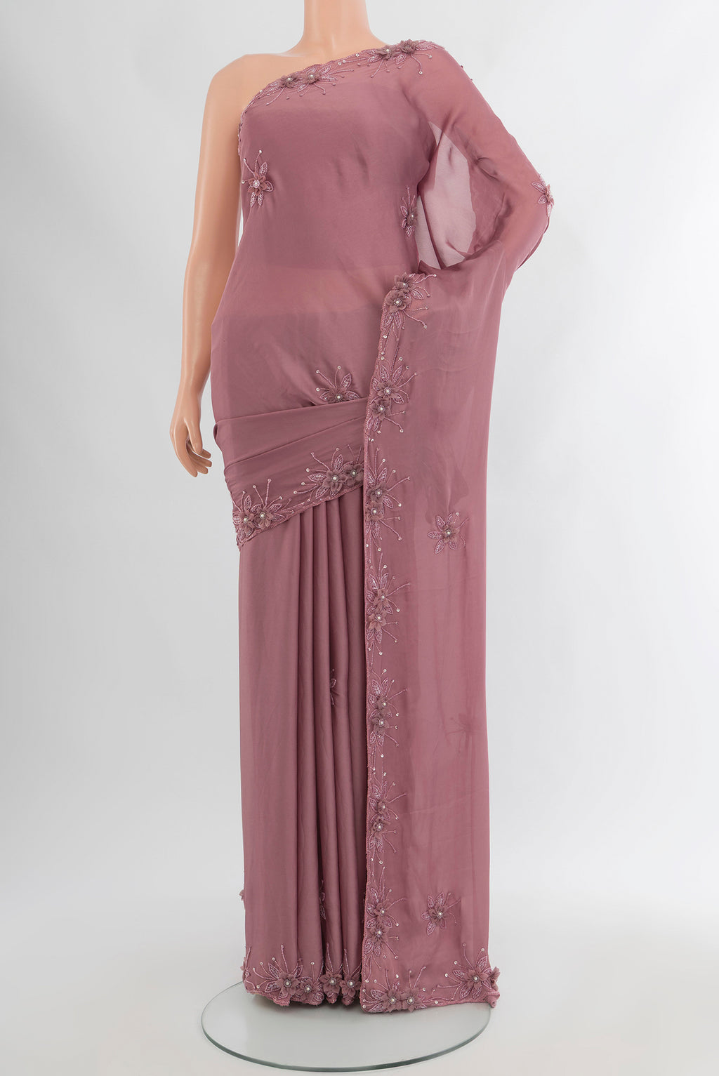 Mauve Blended Crepe Saree with Embroidery on the body and Embroidery Border.  displayed on a mannequin