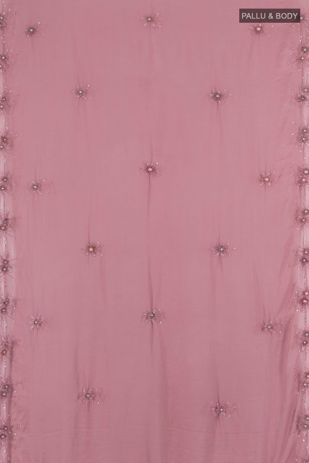 Flat view of Mauve Blended Crepe Saree with Embroidery on the body and Embroidery Border. 