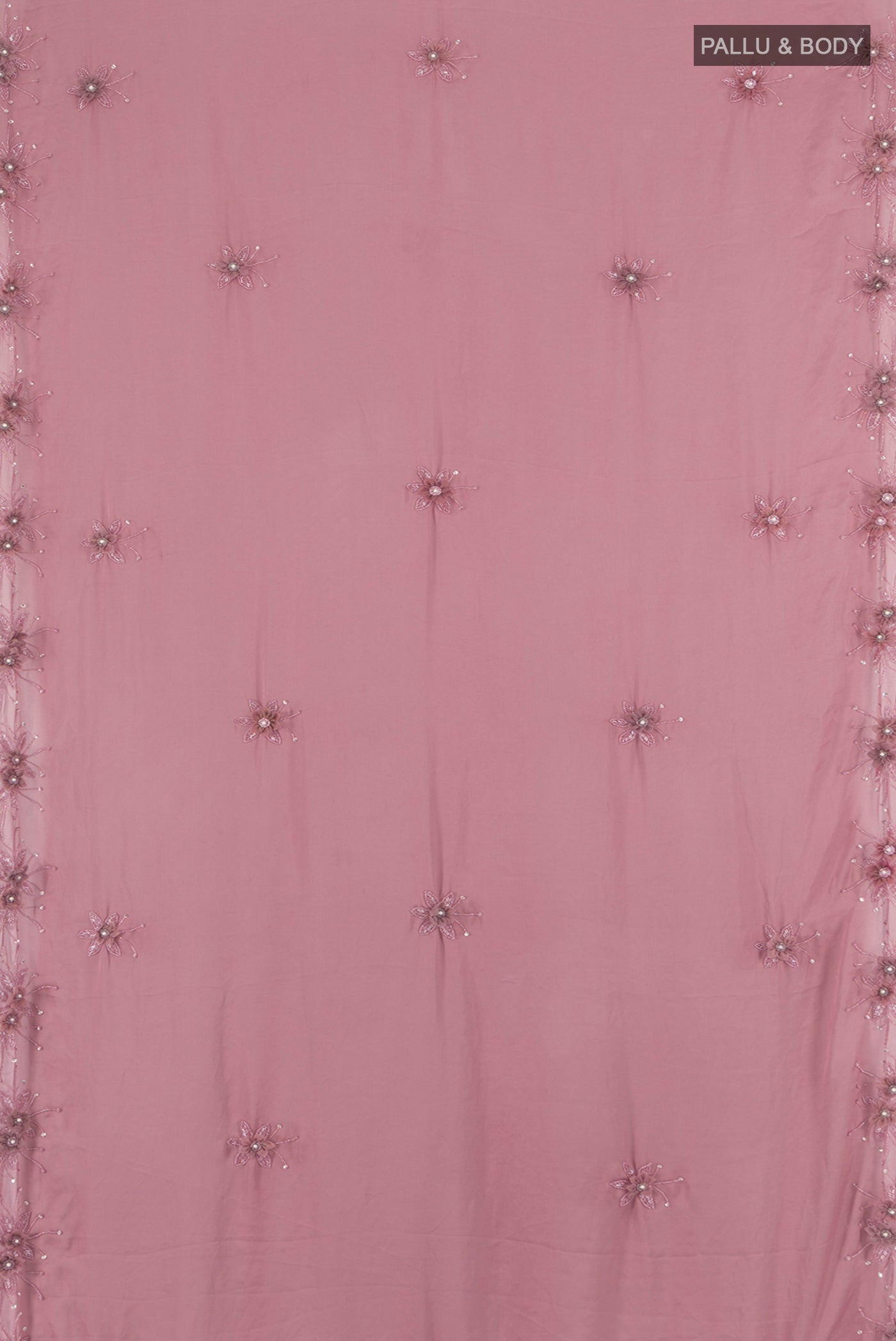 Flat view of Mauve Blended Crepe Saree with Embroidery on the body and Embroidery Border. 