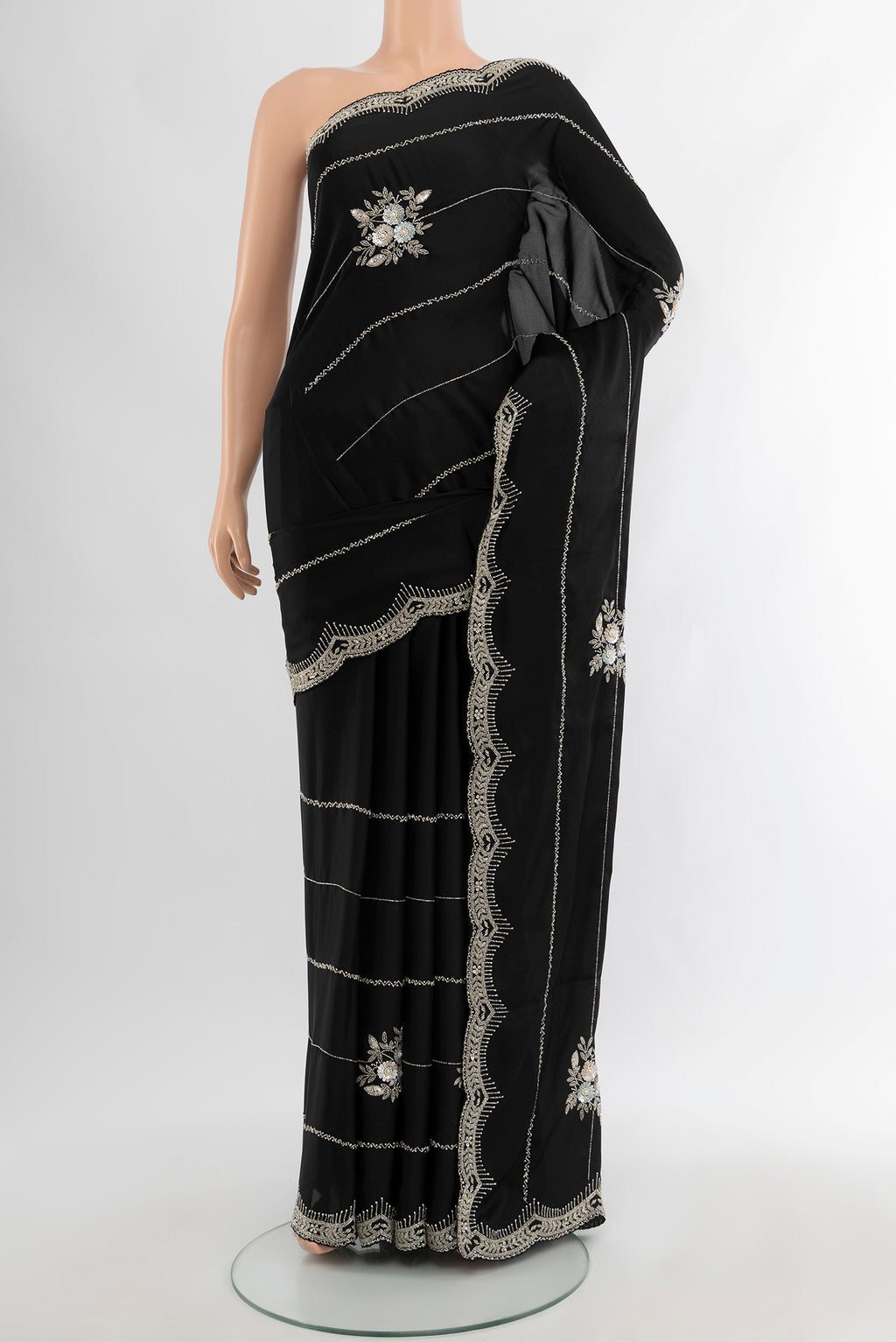 Black Blended Crepe Saree with Embroidery on the body and Embroidery Border.  displayed on a mannequin