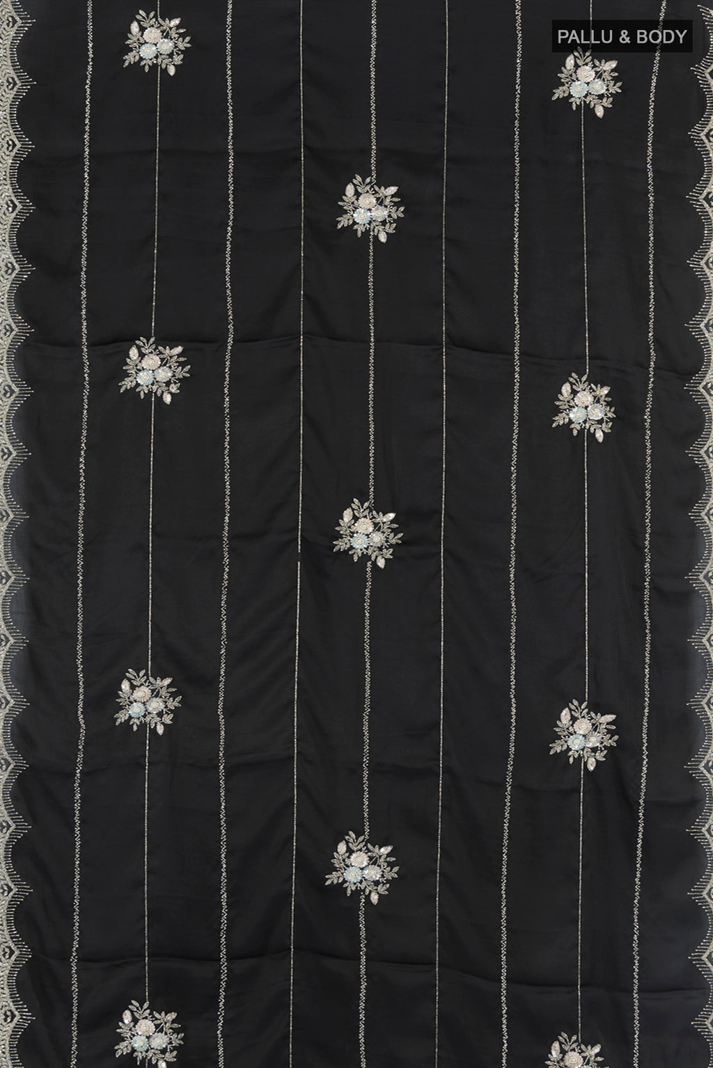 Flat view of Black Blended Crepe Saree with Embroidery on the body and Embroidery Border. 