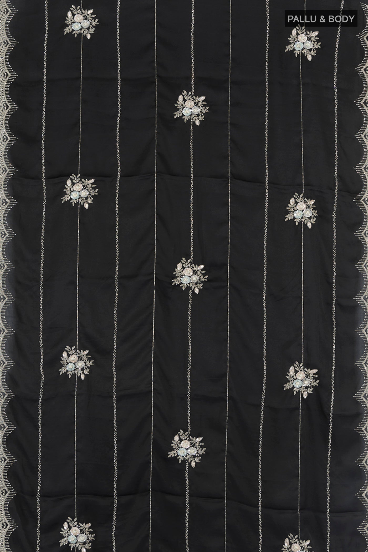 Flat view of Black Blended Crepe Saree with Embroidery on the body and Embroidery Border. 