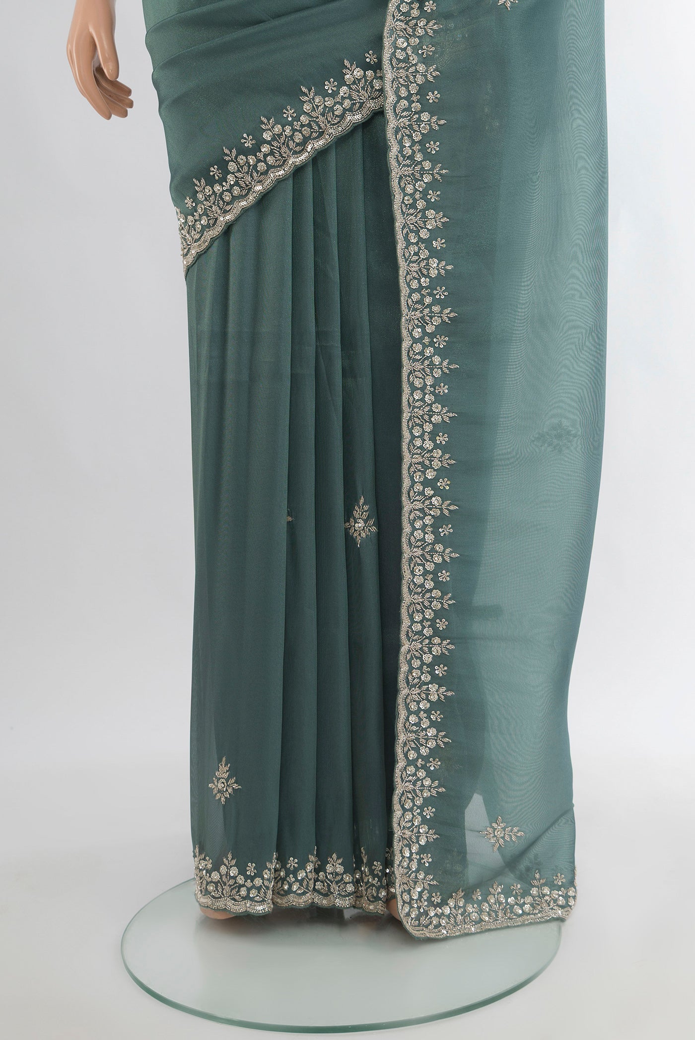 Pleats and pallu of Grey Blended Embroidery Net Saree with Embroidery on the body and Embroidery Border. 