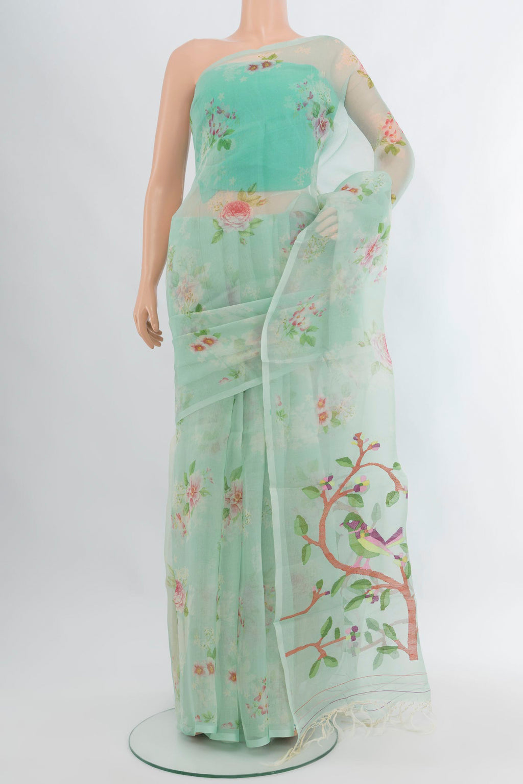 Sea Green Organza Silk Saree with Floral Print on the body and Without Border.  displayed on a mannequin