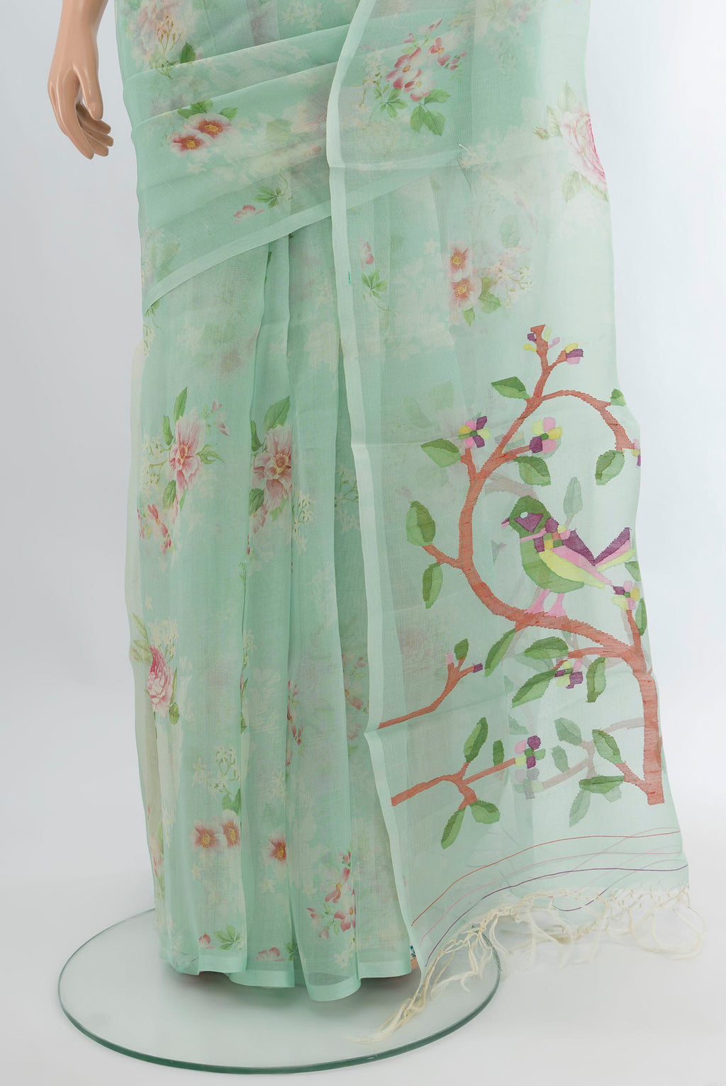 Pleats and pallu of Sea Green Organza Silk Saree with Floral Print on the body and Without Border. 