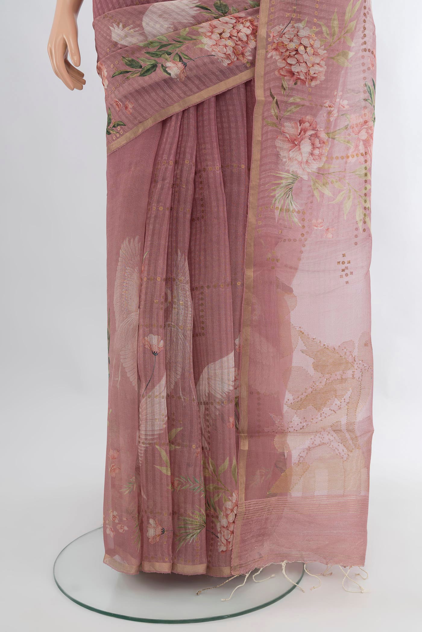 Pleats and pallu of Mauve Organza Silk Saree with Floral Print on the body and Zari Border. 