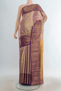 Pure Silk Pure Zari Golden Kanjivaram Saree with Zari Butta on the body and Silk Border.  displayed on a mannequin