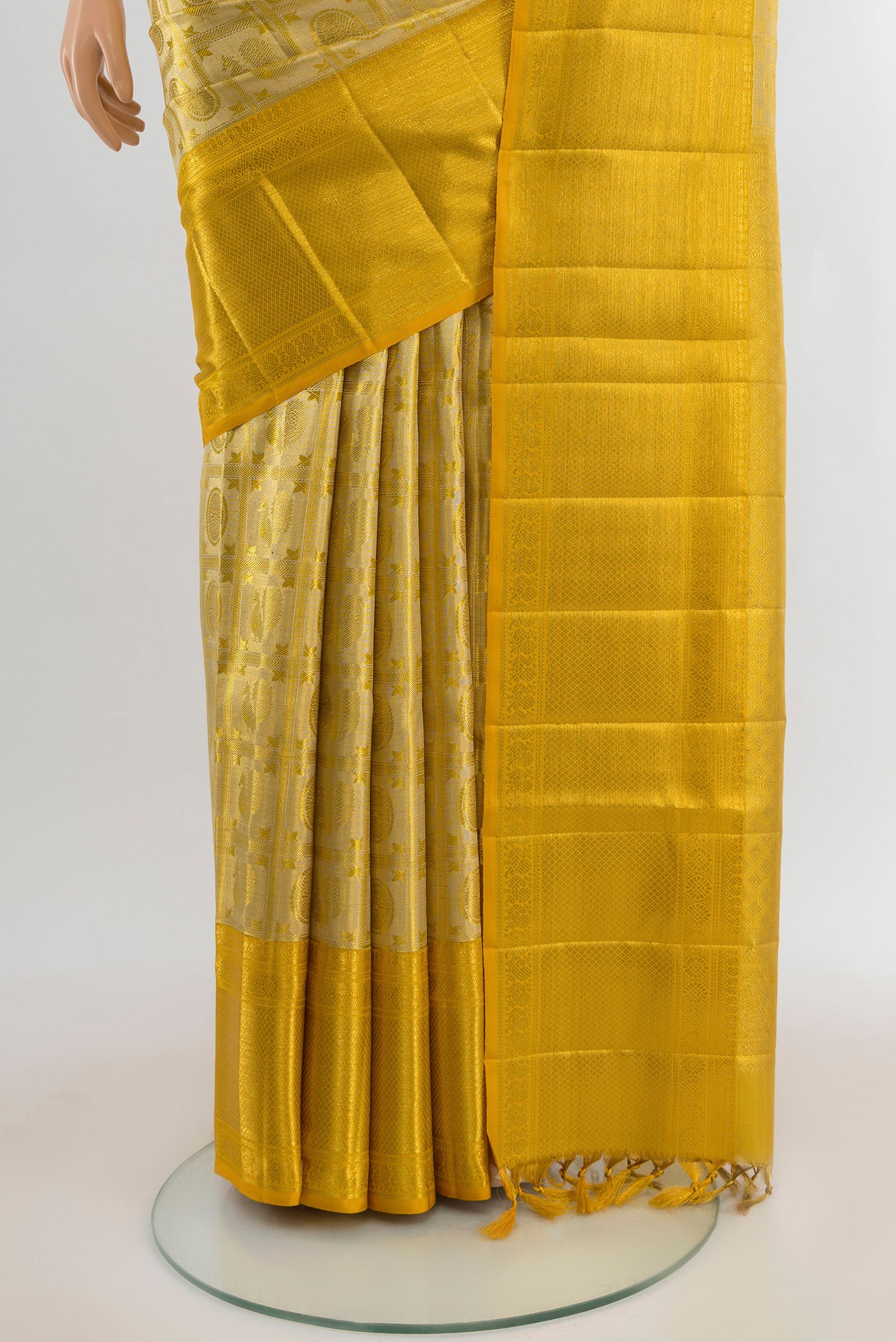 Pleats and pallu of Golden Kanjivaram Tissue Silk Saree with Zari Brocade on the body and Zari Border. 