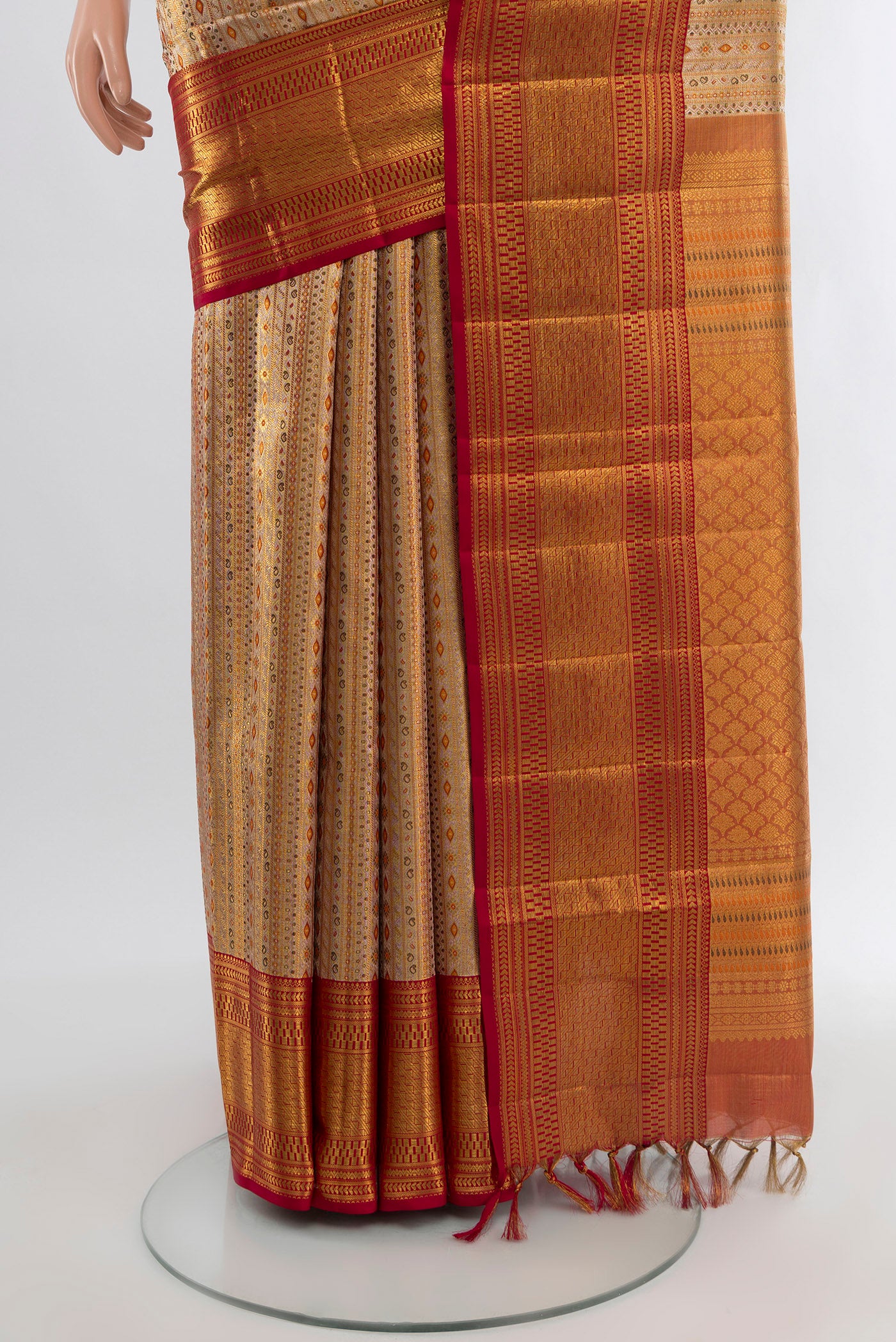 Pleats and pallu of Golden Kanjivaram Tissue Silk Saree with Zari Brocade on the body and Zari Border. 