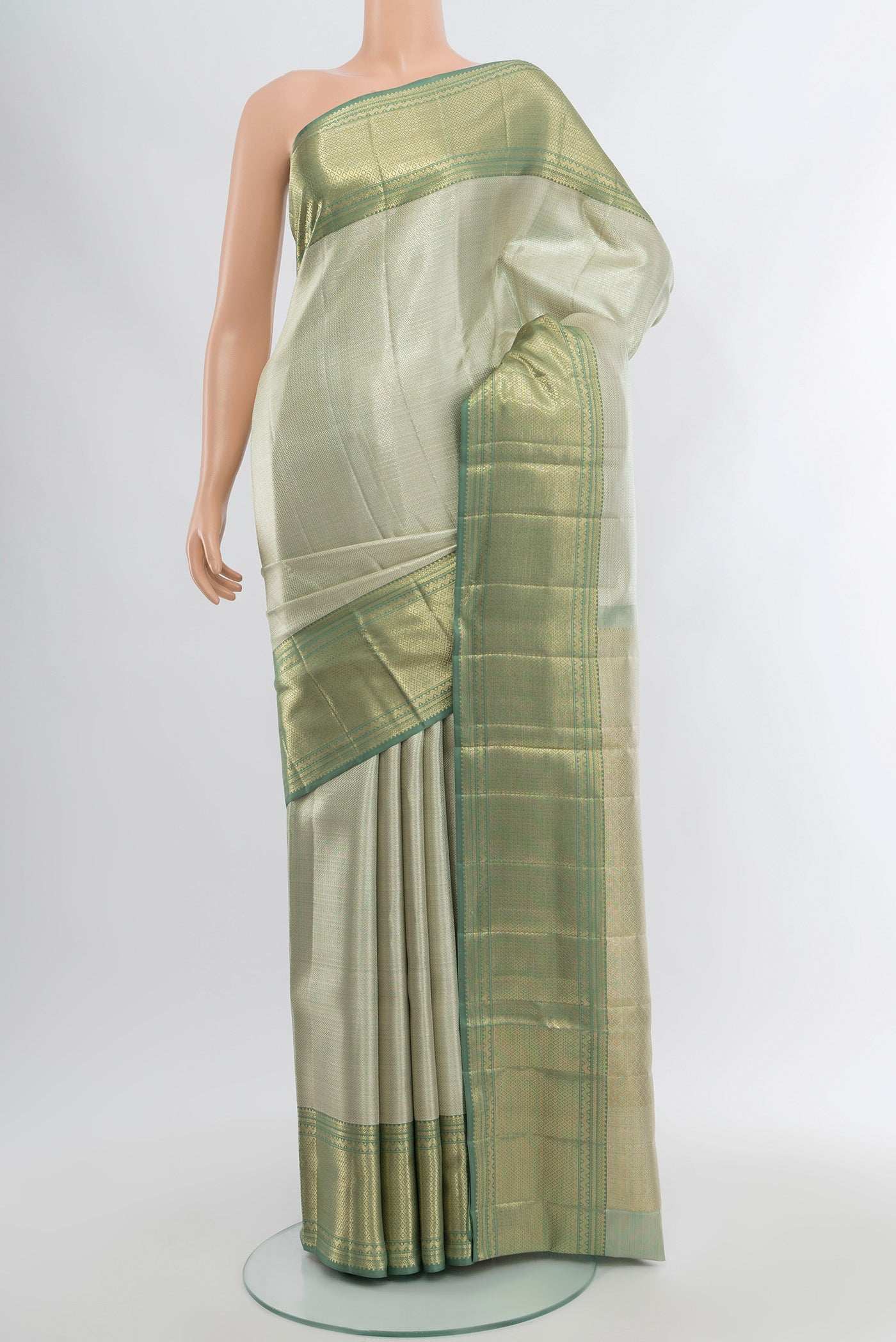 Silver Kanjivaram Tissue Silk Saree with Zari Brocade on the body and Zari Border.  displayed on a mannequin