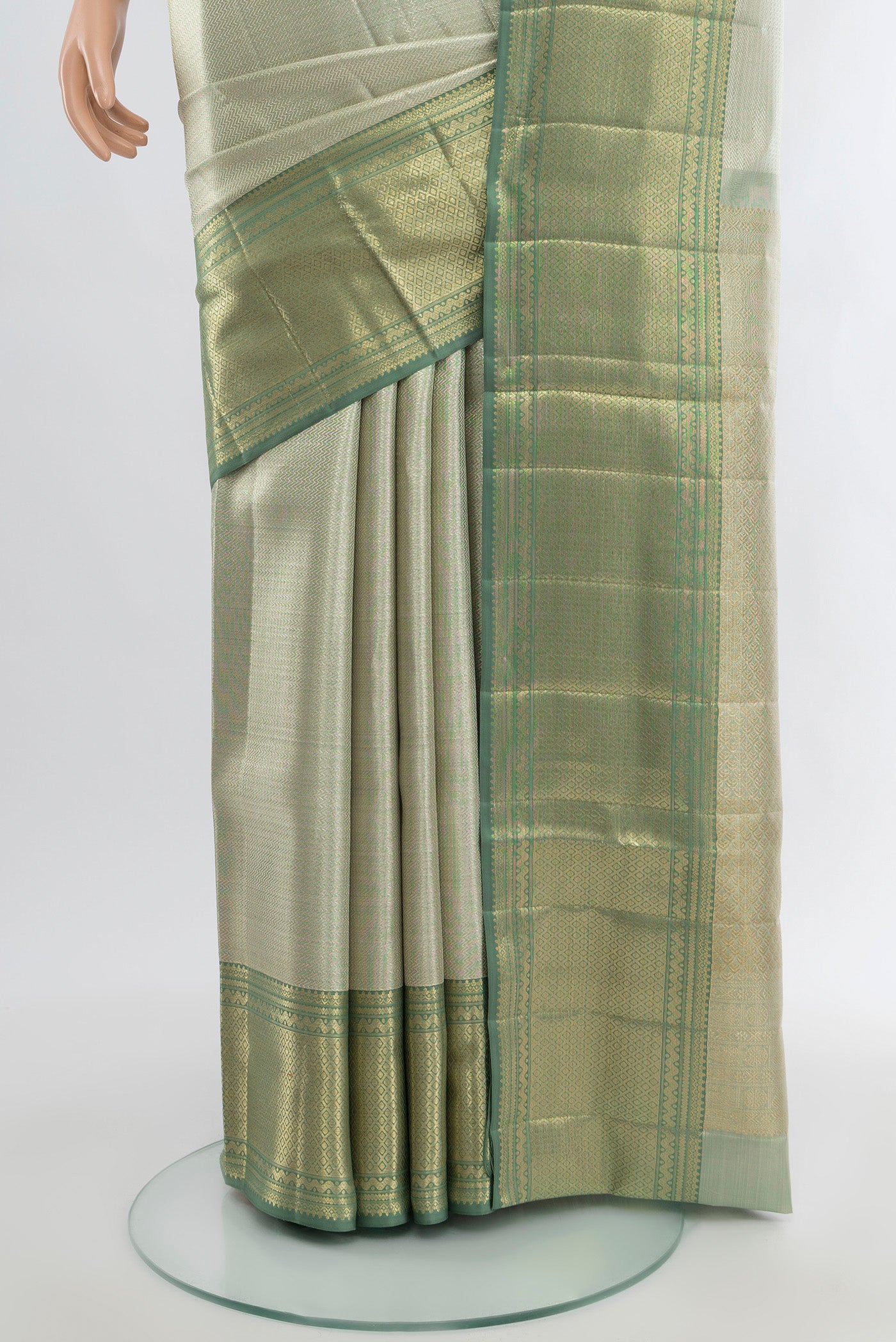 Pleats and pallu of Silver Kanjivaram Tissue Silk Saree with Zari Brocade on the body and Zari Border. 