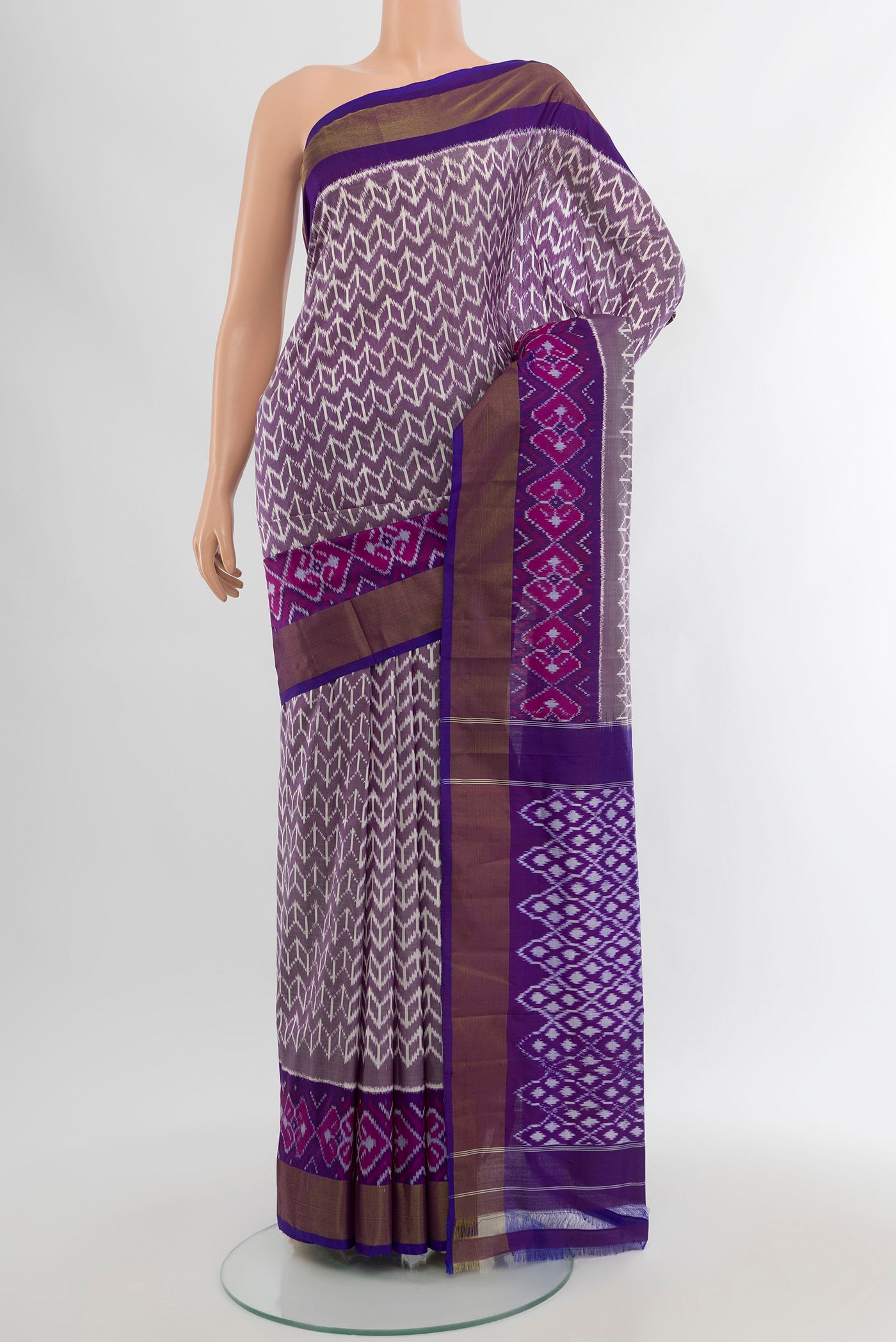 Purple Pochampally Silk Saree with Pure Ikat on the body and Zari Border.  displayed on a mannequin