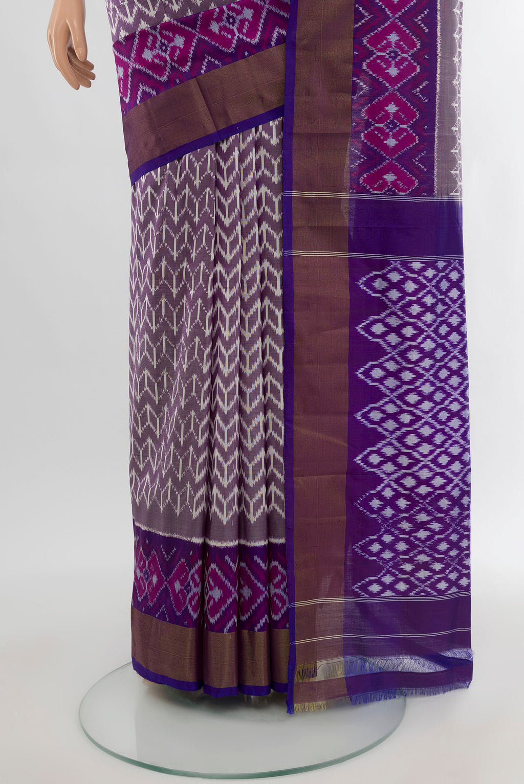 Pleats and pallu of Purple Pochampally Silk Saree with Pure Ikat on the body and Zari Border. 