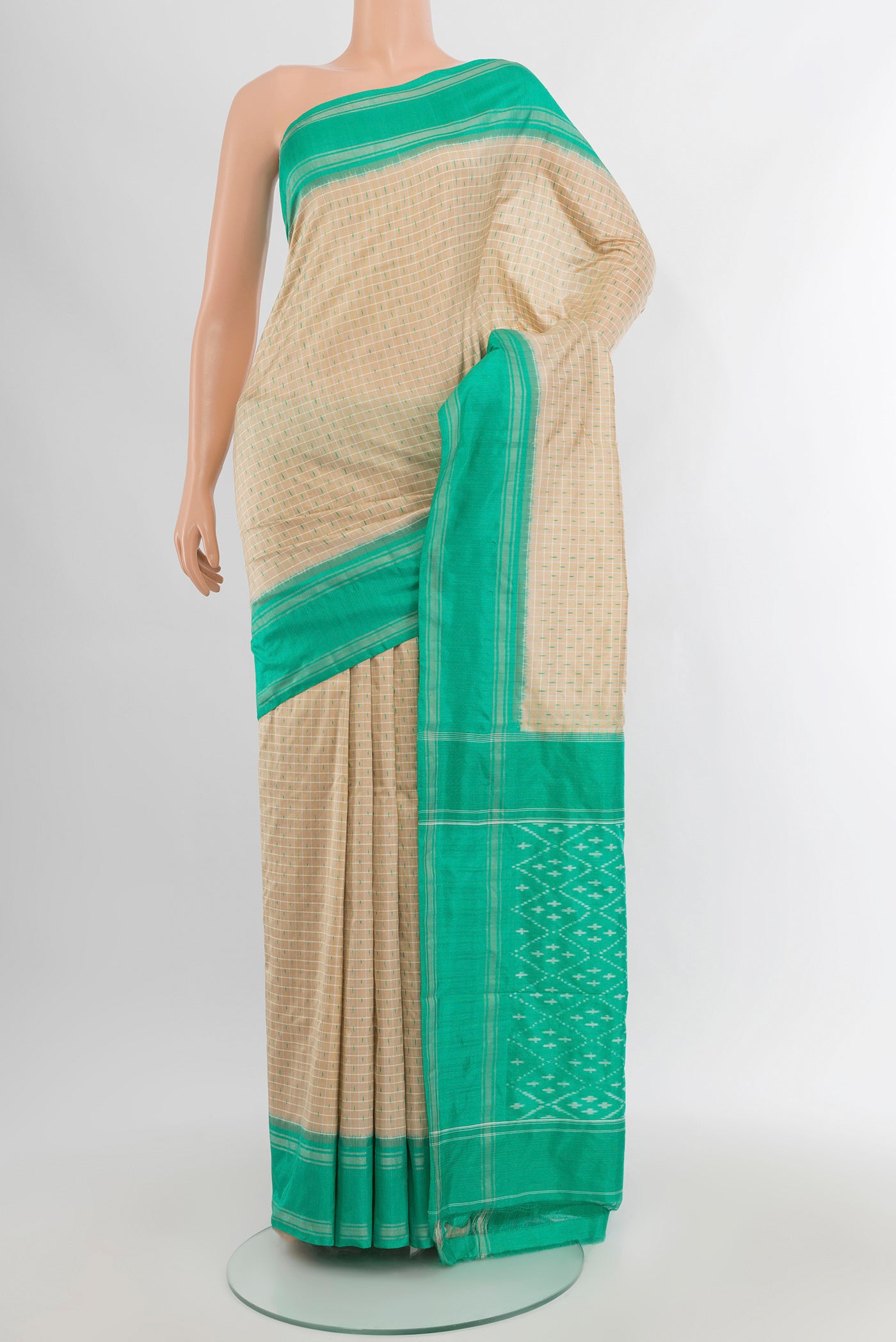 Cream Pochampally Silk Saree with Ikat design on the body and Plain Border.  displayed on a mannequin