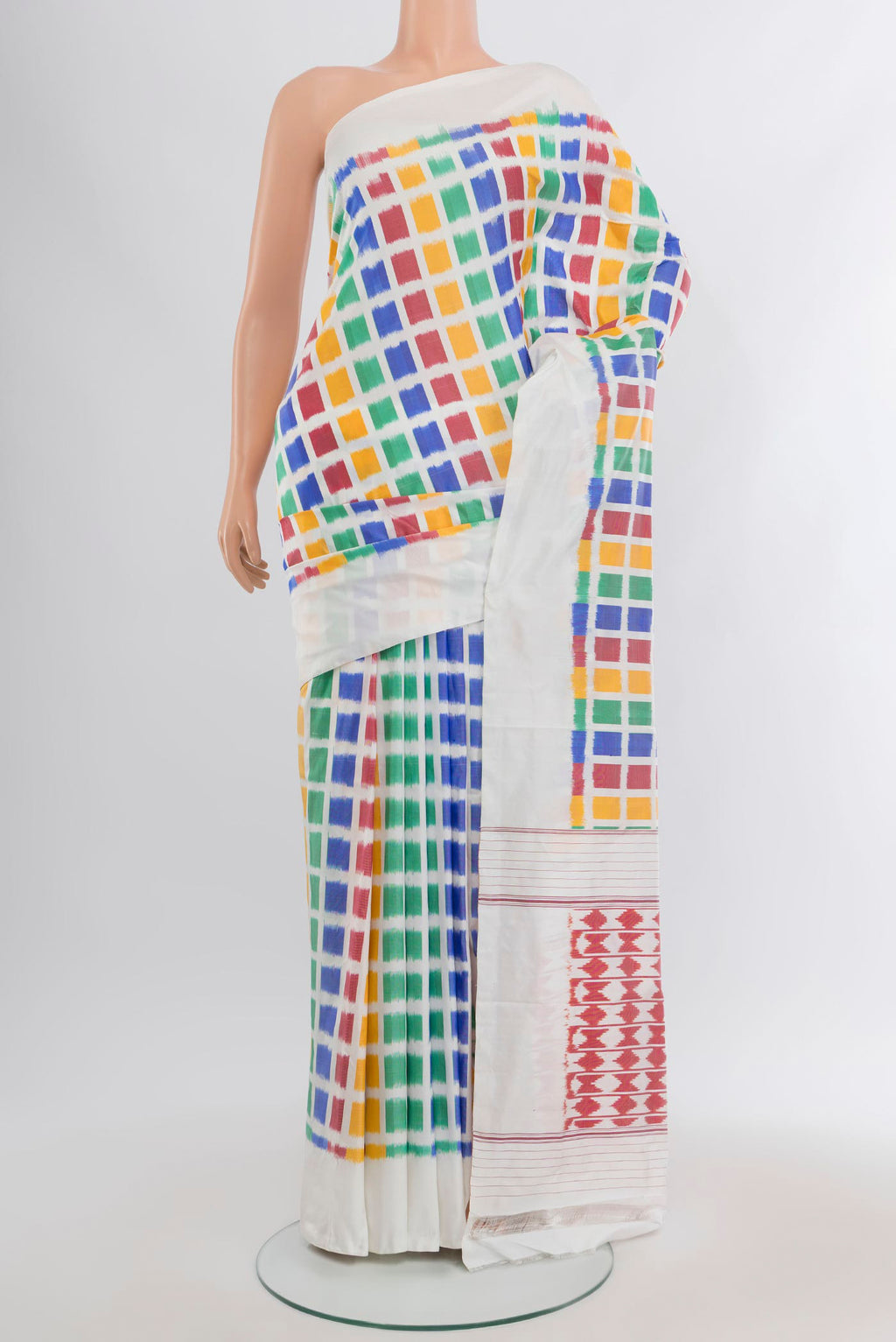 Multi Color Pochampally Silk Saree with Pure Ikat on the body and Plain Border.  displayed on a mannequin