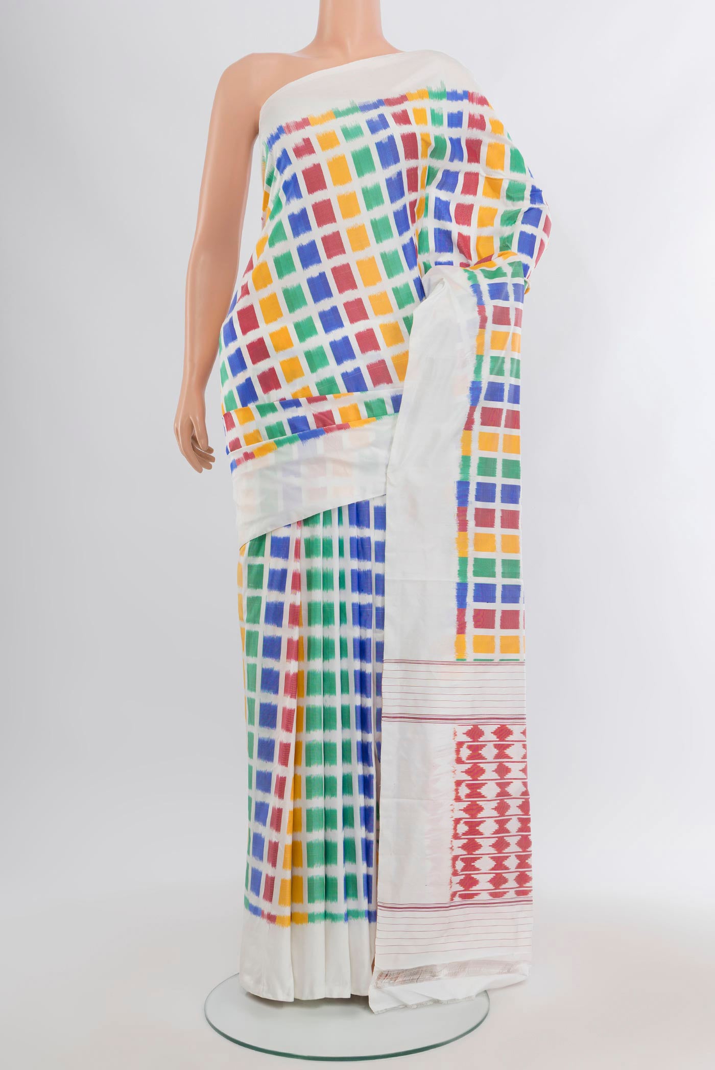 Multi Color Pochampally Silk Saree with Pure Ikat on the body and Plain Border.  displayed on a mannequin