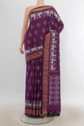 Pure Silk Purple Pochampally Saree with Pure Ikat on the body and Zari Border.  displayed on a mannequin