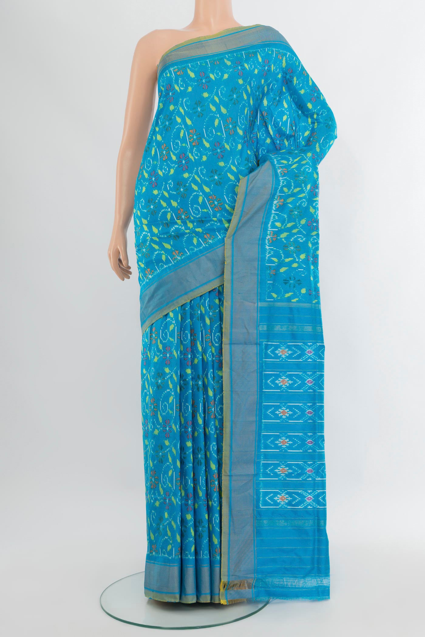 Sky Blue Pochampally Silk Saree with Pure Ikat on the body and Zari Border.  displayed on a mannequin