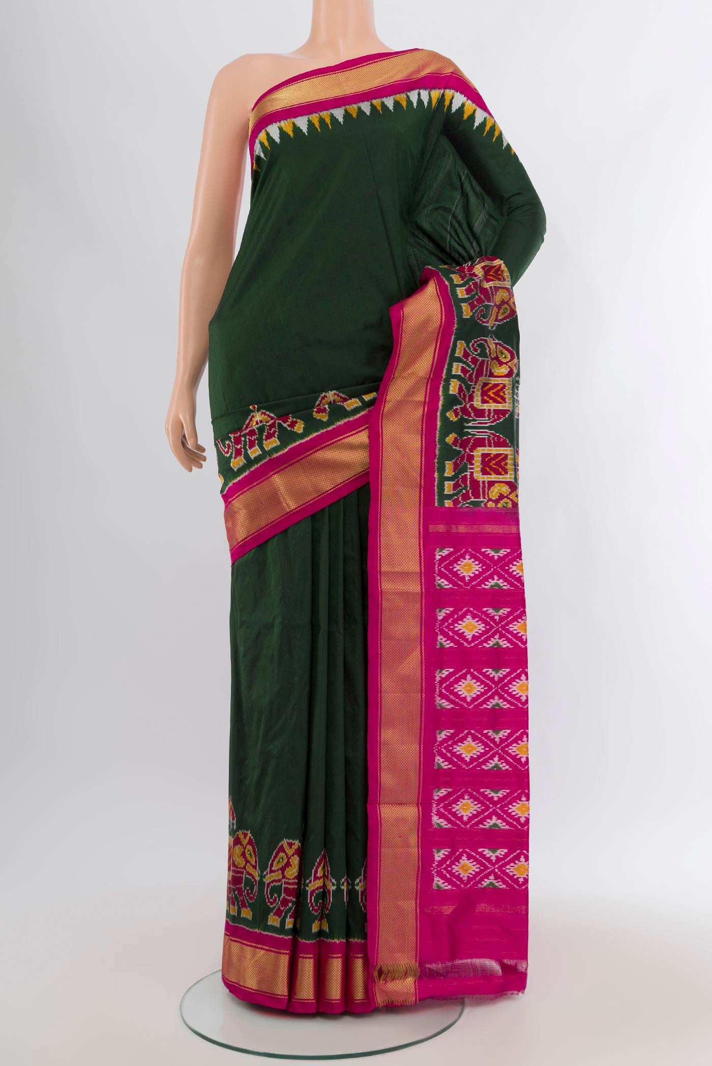 Bottle Green Pochampally Silk Saree with Plain Body and Zari Border.  displayed on a mannequin