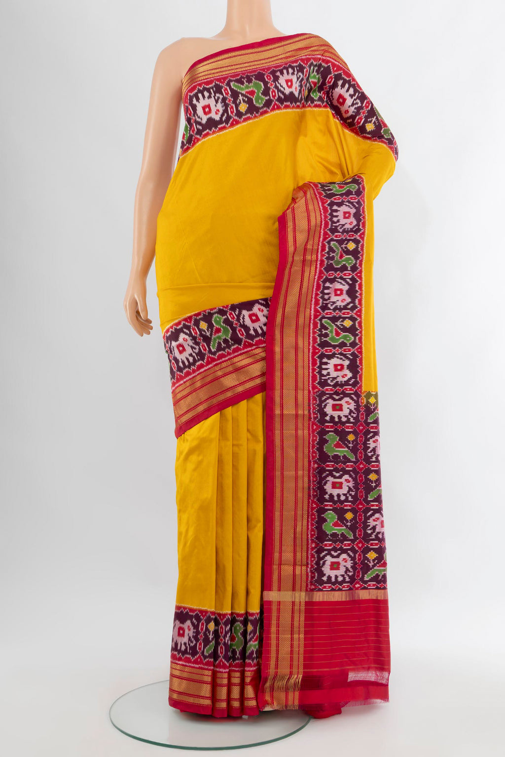 Yellow Pochampally Silk Saree with Plain Body and Zari Border.  displayed on a mannequin