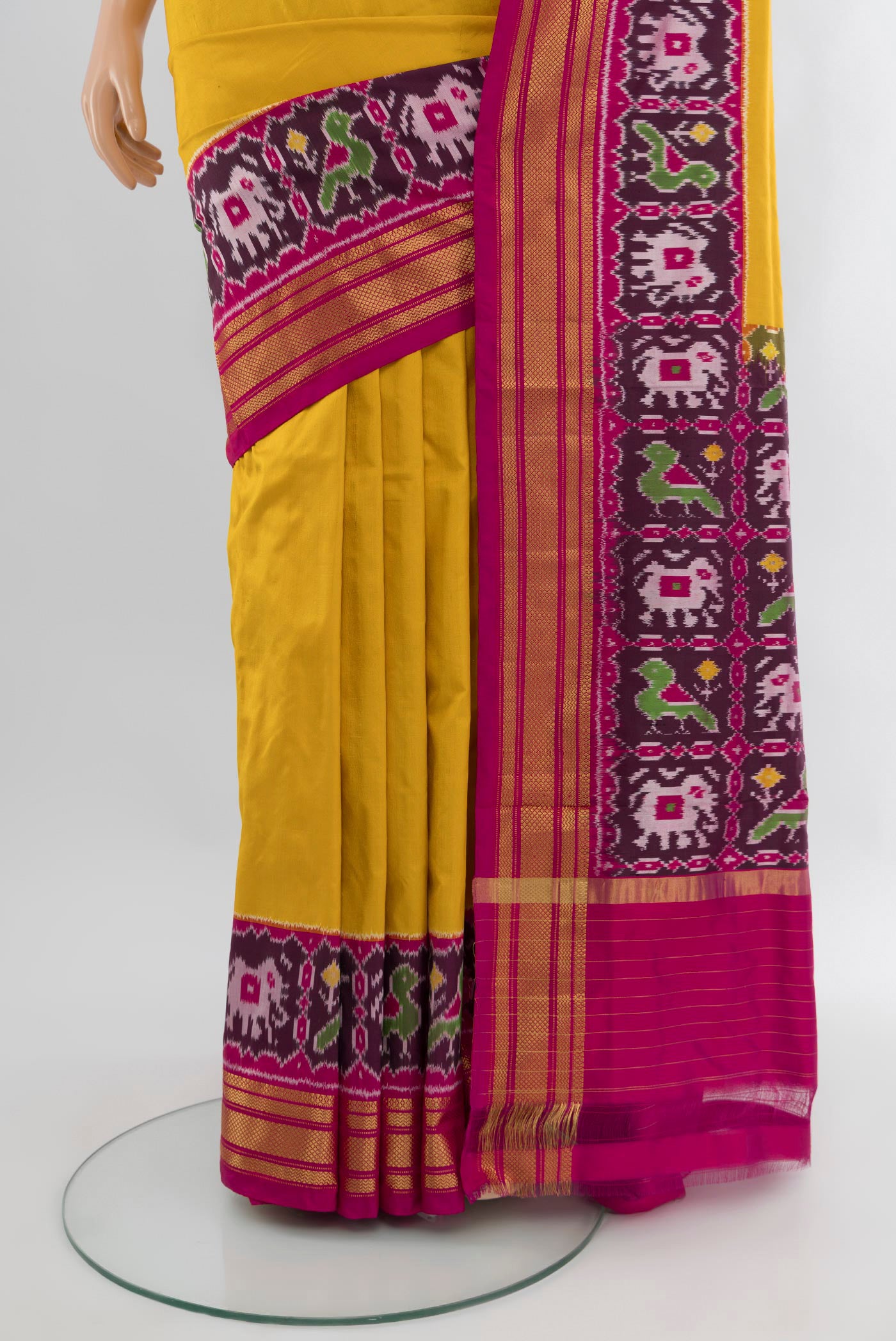 Pleats and pallu of Yellow Pochampally Silk Saree with Plain Body and Zari Border. 