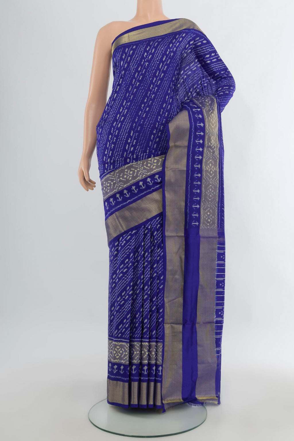 Pure Silk Blue Pochampally Saree with Pure Ikat on the body and Zari Border.  displayed on a mannequin