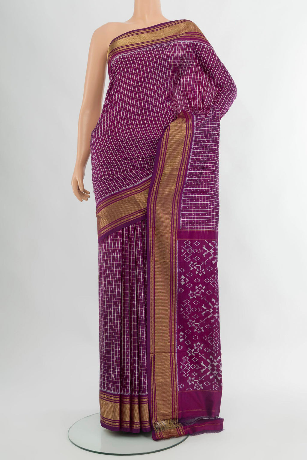 Purple Pochampally Silk Saree with Ikat design on the body and Zari Border.  displayed on a mannequin