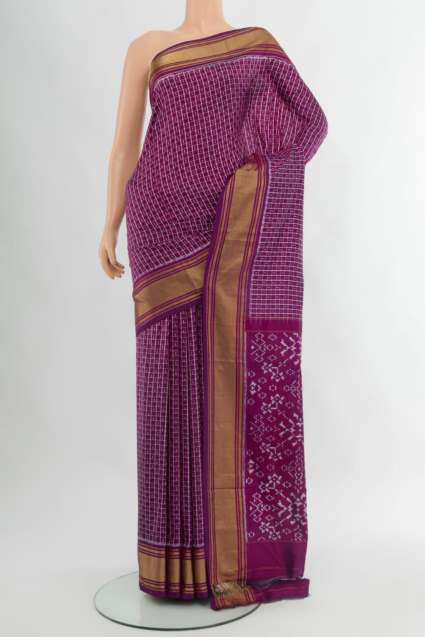Purple Pochampally Silk Saree with Ikat design on the body and Zari Border.  displayed on a mannequin