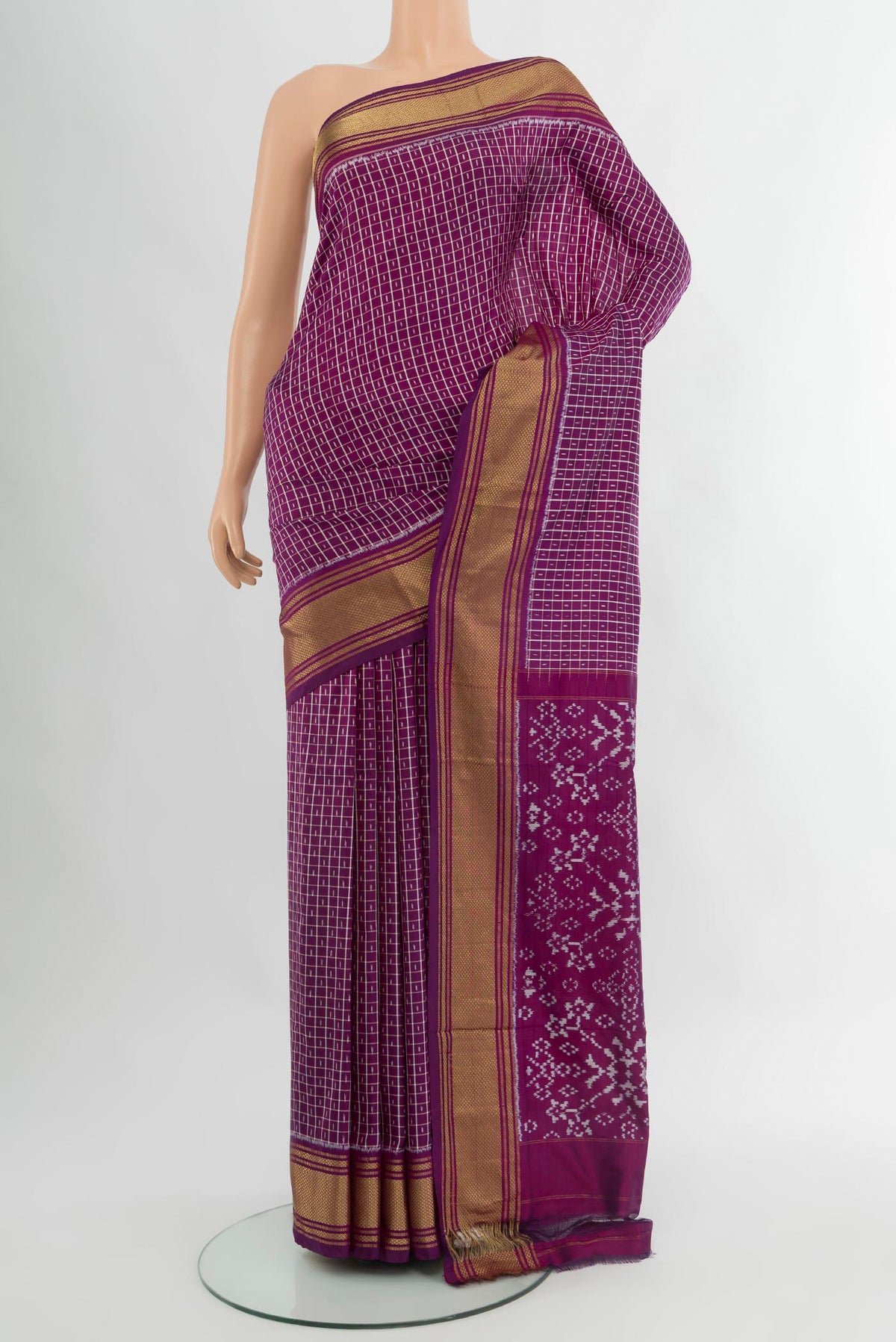Purple Pochampally Silk Saree with Ikat design on the body and Zari Border.  displayed on a mannequin