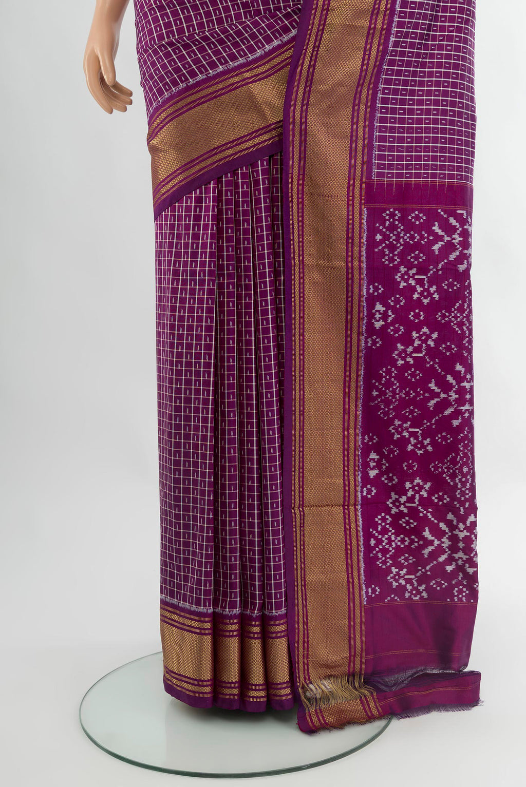 Pleats and pallu of Purple Pochampally Silk Saree with Ikat design on the body and Zari Border. 