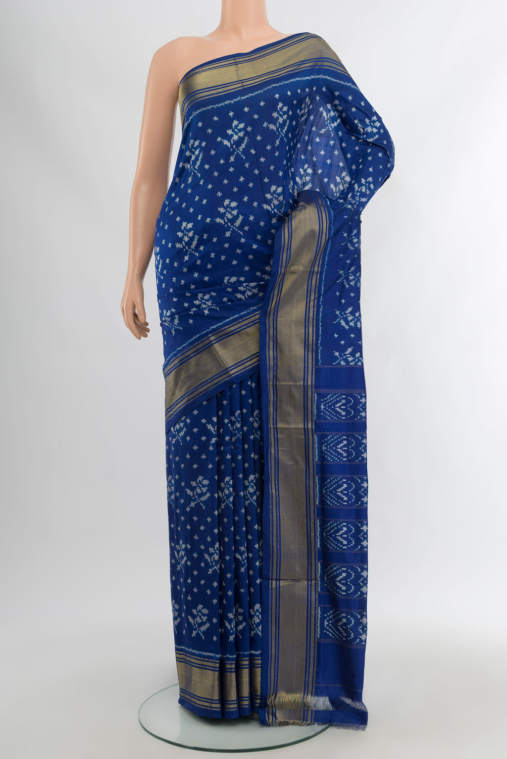Royal Blue Pochampally Silk Saree with Ikat design on the body and Zari Border.  displayed on a mannequin