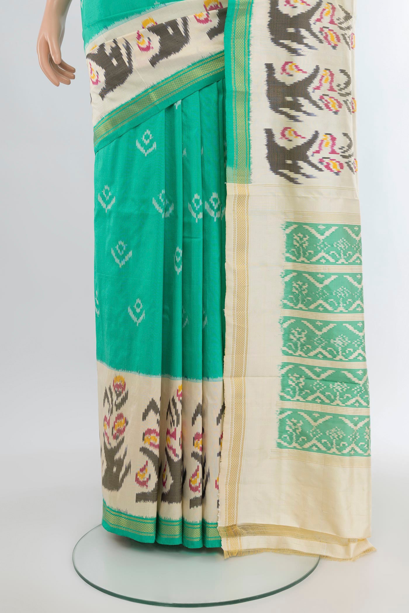 Pleats and pallu of Sea Green Pochampally Silk Saree with Pure Ikat on the body and Ikat Border. 