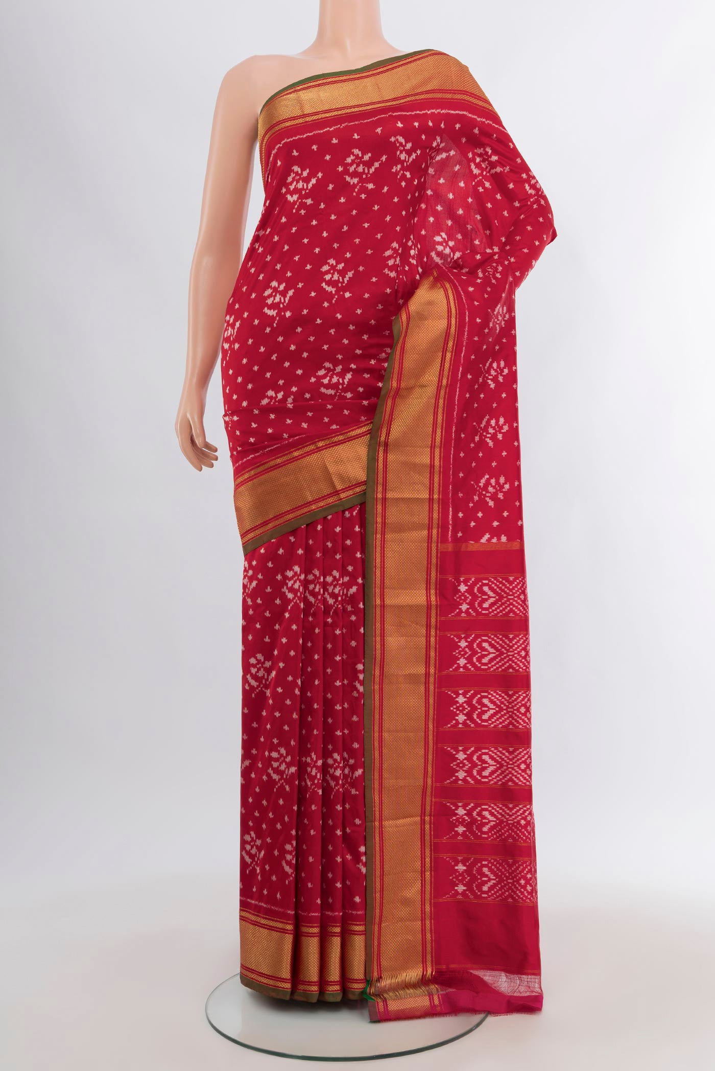 Red Pochampally Silk Saree with Ikat design on the body and Zari Border.  displayed on a mannequin
