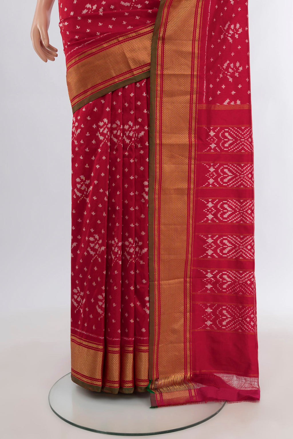 Pleats and pallu of Red Pochampally Silk Saree with Ikat design on the body and Zari Border. 
